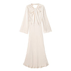 Backless long-sleeve maxi dress with sleek fitted silhouette