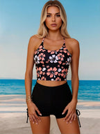 Floral halter crop bikini top with black side-tie high-waist swim shorts