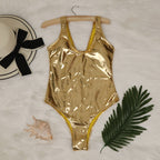 Gold metallic high-cut swimsuit with scoop neckline and thin straps on hanger