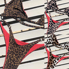 Leopard-print one-piece bikini with red-trim halter and thong-style back straps