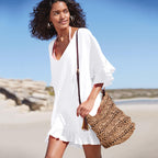 White slub cotton one-piece swimwear with V-neck, drawstring, and ruffled hem