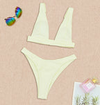 Pale yellow two-piece push-up bikini with V-neck triangle top and high-cut bottoms