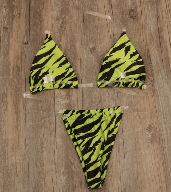 Neon green zebra stripe bikini top and matching high-cut bottom with white tie closures