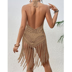 Beige crochet halter one-piece swimsuit cover from back with strappy openwork and fringe