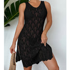 Black sleeveless mid-length dress with beaded-look pattern and scalloped hem