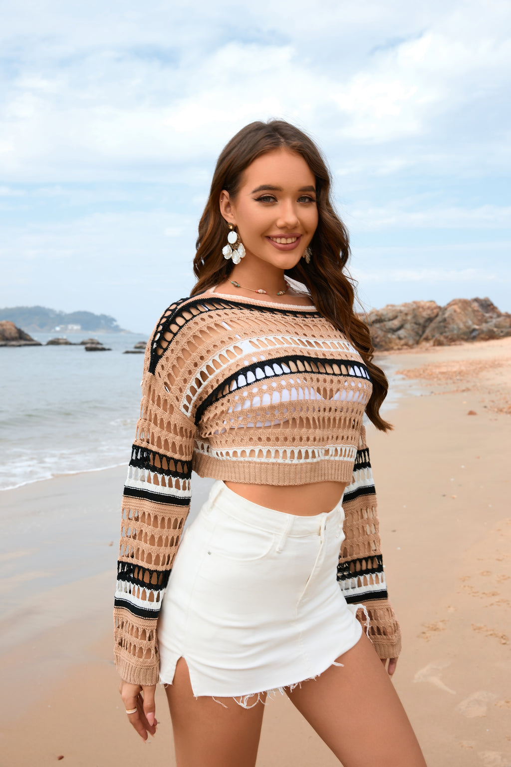 Women’s cream and black striped hollow-knit crop sweater with long wide sleeves