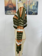 Women’s striped hollow-knit crop sweater on mannequin, green with orange and white bands