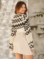 Women’s crocheted long-sleeve cardigan, zigzag pattern back view in cream and black