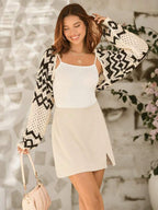 Women’s crocheted long-sleeve cardigan, open knit zigzag sleeves in cream and black