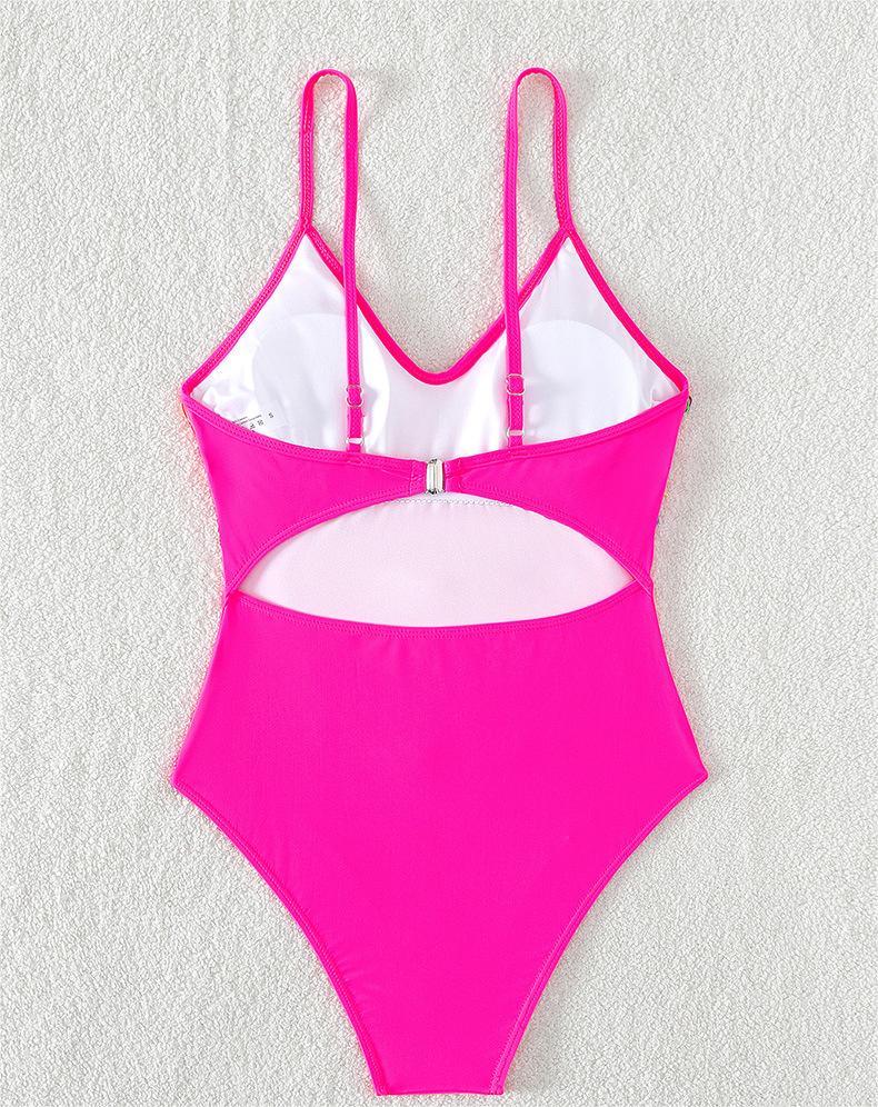 Pink fringed one-piece swimsuit with spaghetti straps and front cutout mesh panel