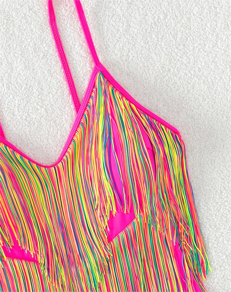 Pink one-piece swimsuit with rainbow fringe strands and thin spaghetti straps