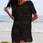 Black openwork crochet pullover tunic with crew neck and scalloped hem, short sleeves