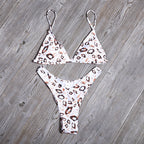 Leopard print bikini set with triangle top and Brazilian panties, white with orange spots