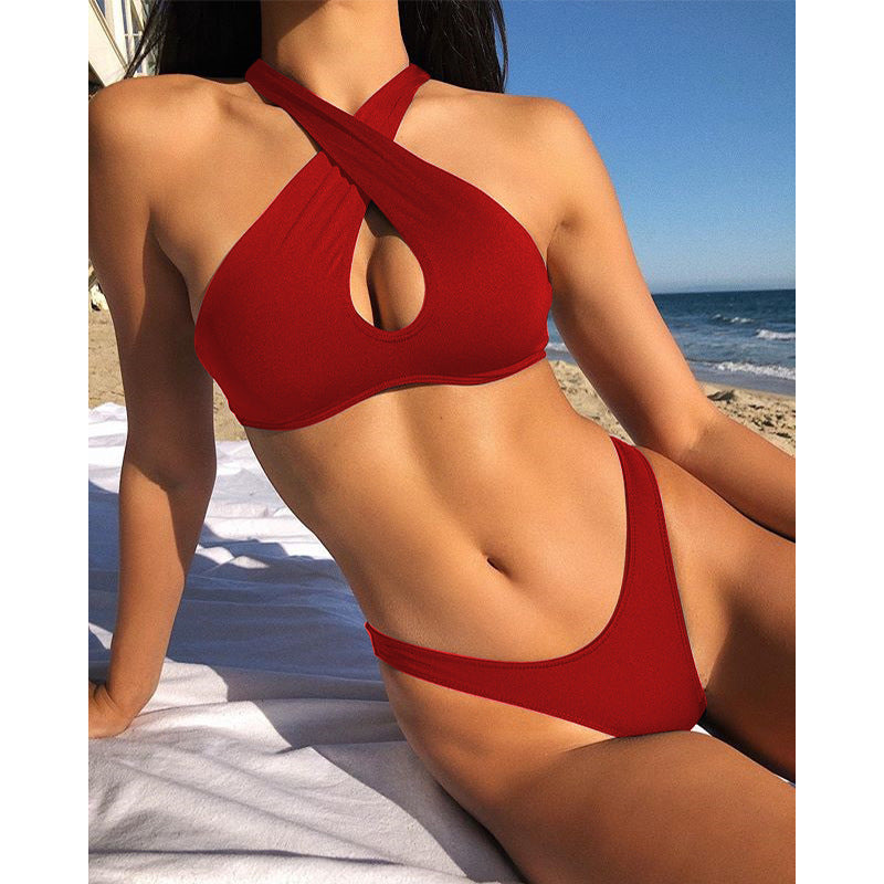 Red halter one-piece swimsuit with crisscross straps and oval bust cutout