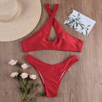 Red halter bikini-style one-piece with strap cross top and high-cut bottom