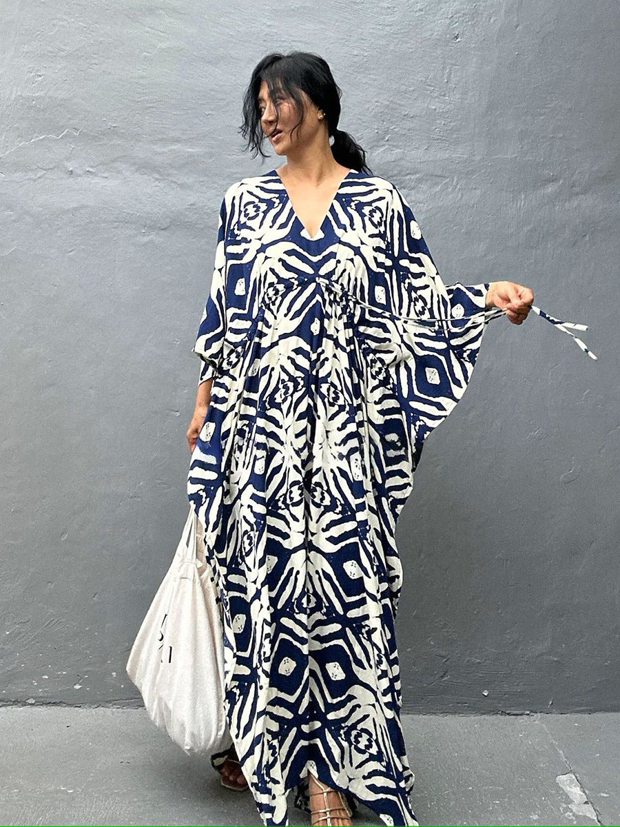 Rayon drawstring maxi dress in navy blue with white animal print, front V-neck