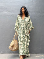 Rayon drawstring maxi dress in light green with white animal print, front V-neck