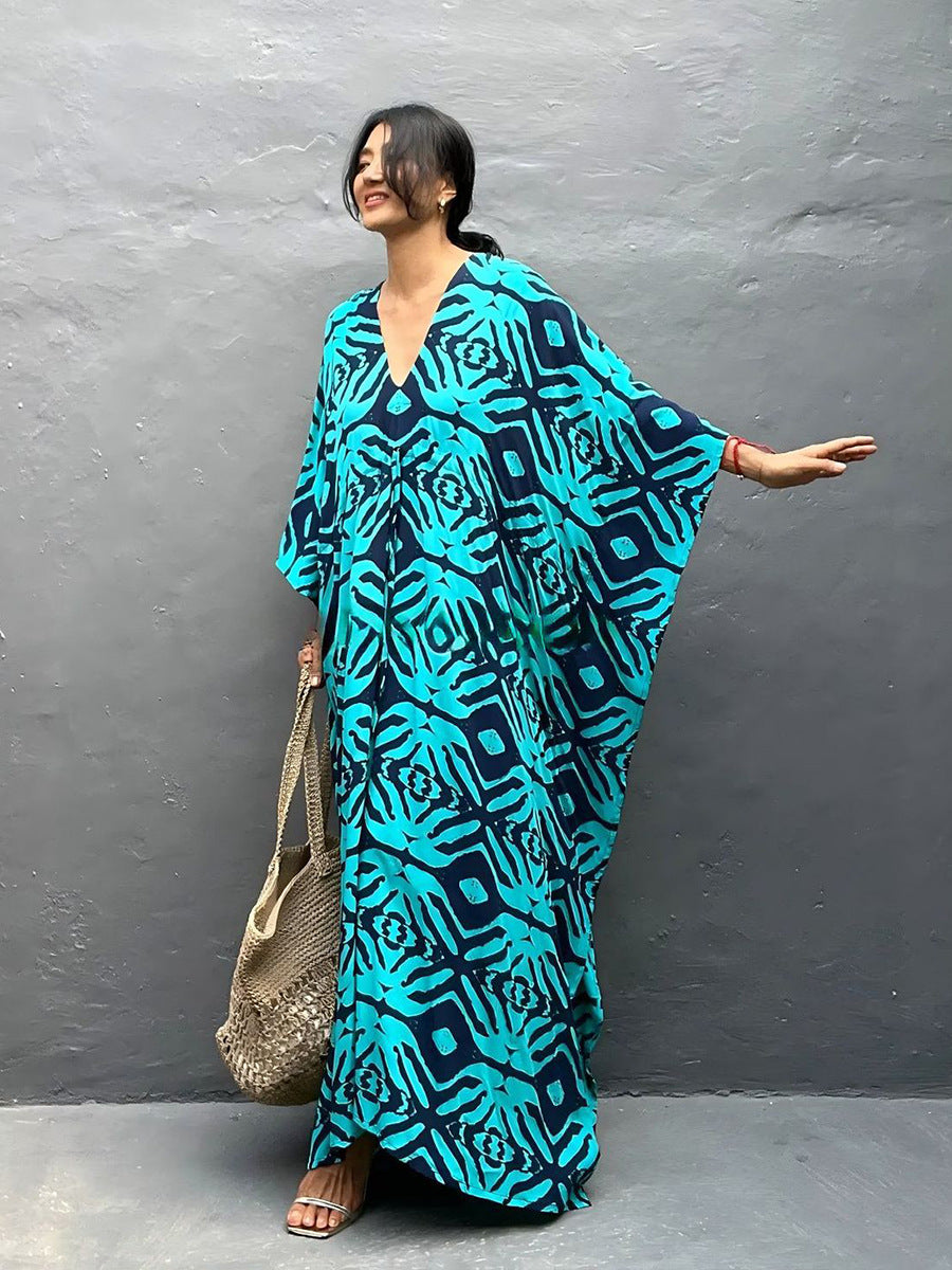 Rayon drawstring maxi dress in bright blue with black animal print, front V-neck