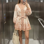 Women's spring dress, cream with terracotta print, tie belt, long puff sleeves
