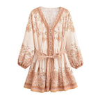 Spring dress with cream base, terracotta floral border print, button front, tie waist
