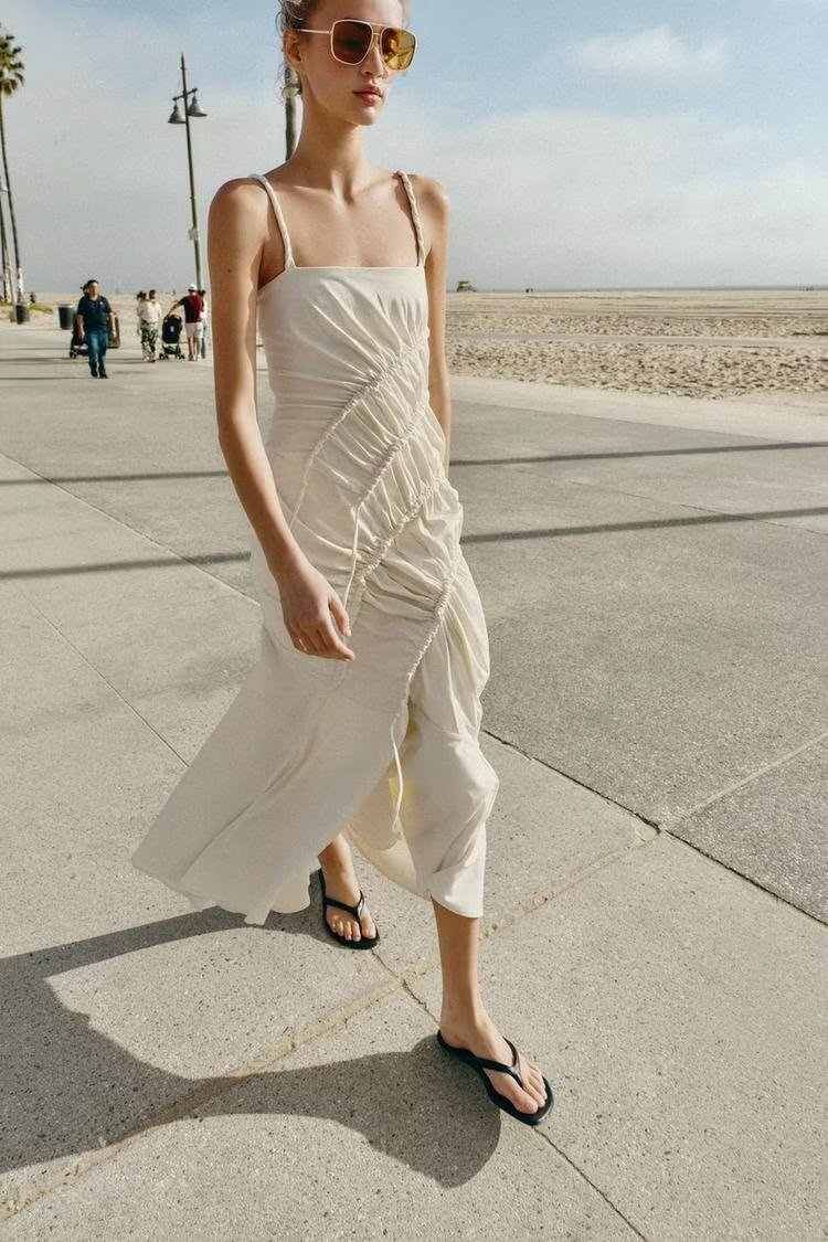 Maxi pleated dress with thin straps, diagonal ruched bodice, off-white