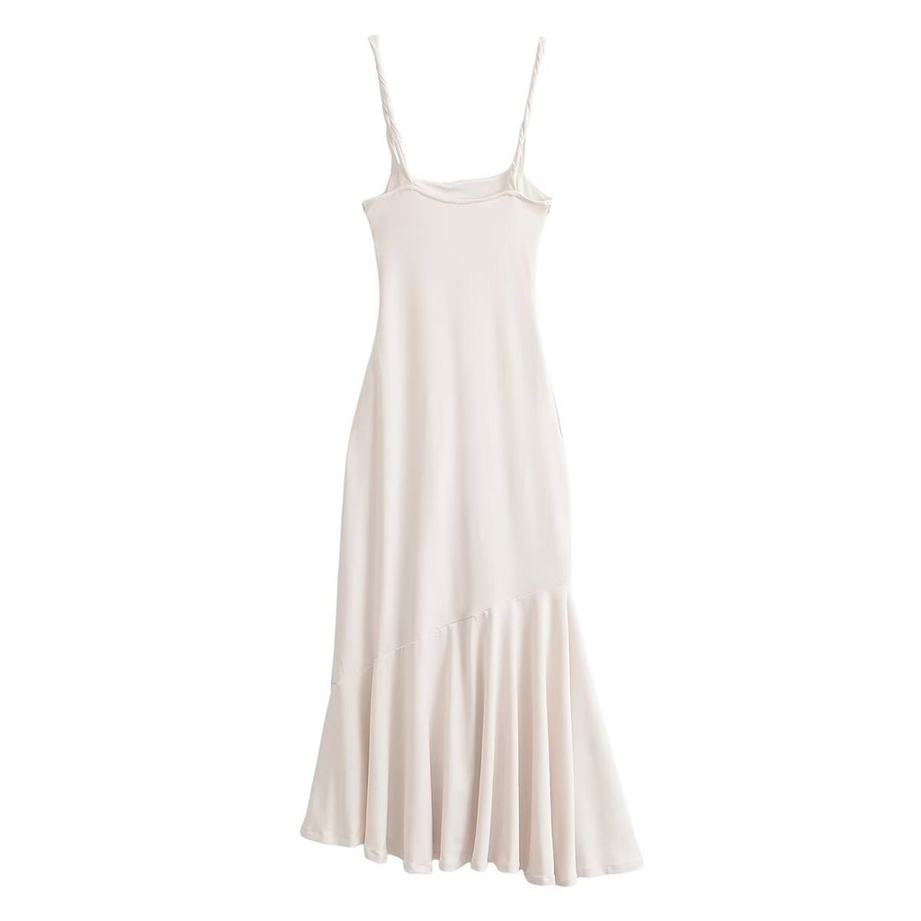 Off-white sleeveless maxi dress with spaghetti straps and gathered hem pleats