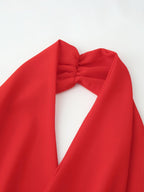Red halter dress close-up of draped cowl neckline and bow-tie detail
