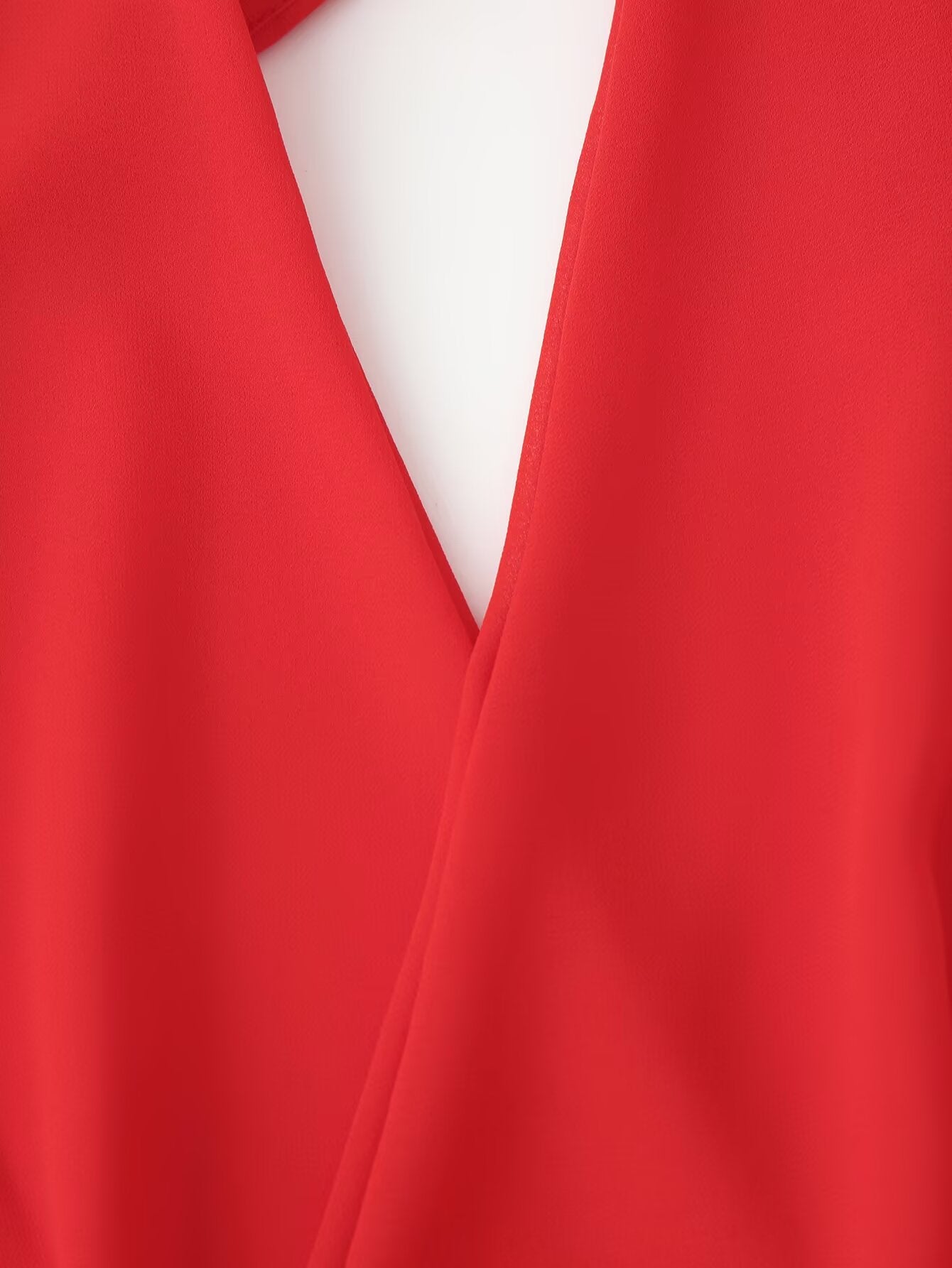 Red halter maxi dress bodice close-up with deep V cutout and wrap seams