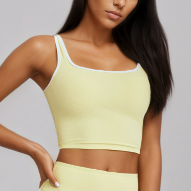 Pale yellow ribbed tank swim top with white-trim square neckline, hand on hip