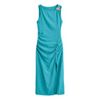 Teal sleeveless midi dress with side slit, ruched waist, and floral shoulder hardware