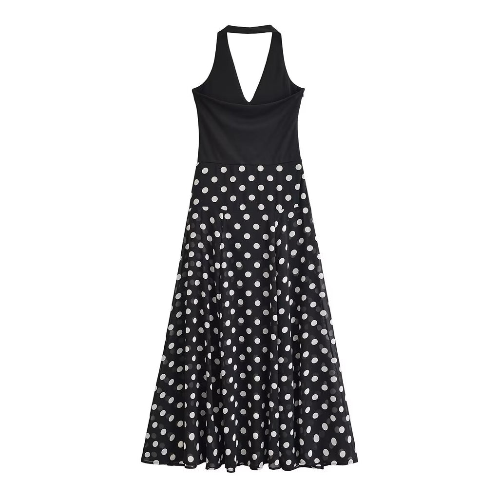 Black sleeveless V-neck dress with white polka dot A-line skirt, midi length