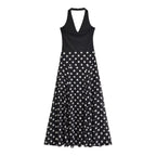 Black sleeveless V-neck dress with white polka dot A-line skirt, midi length