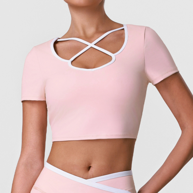 Women's sports crop top, light pink with white crisscross cutout neckline