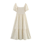 Cream short-sleeve tiered dress with puff sleeves and smocked waist, allover tiny print