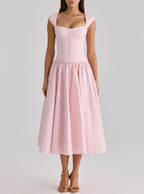 Pink cocktail formal dress with corset-style bodice, wide straps, gathered midi skirt