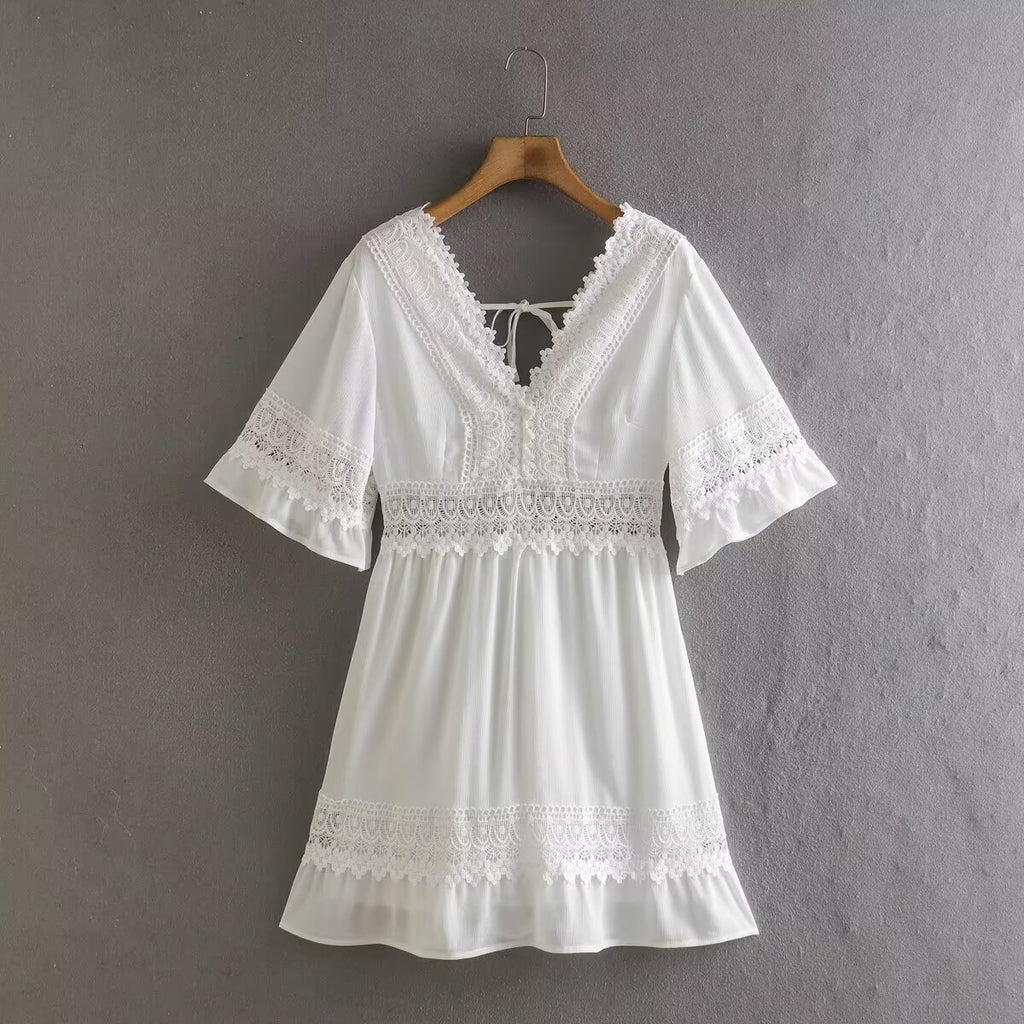 White summer dress with lace scalloped hem and decorative waist yoke