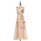 Floral sleeveless midi dress in light blush with fitted waist and tiered skirt