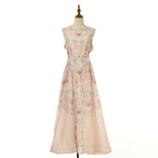 Floral sleeveless midi dress in blush pink with round neckline and cinched waist