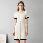 Ivory ribbed knit button-front dress with pointed collar, short sleeves, black trim