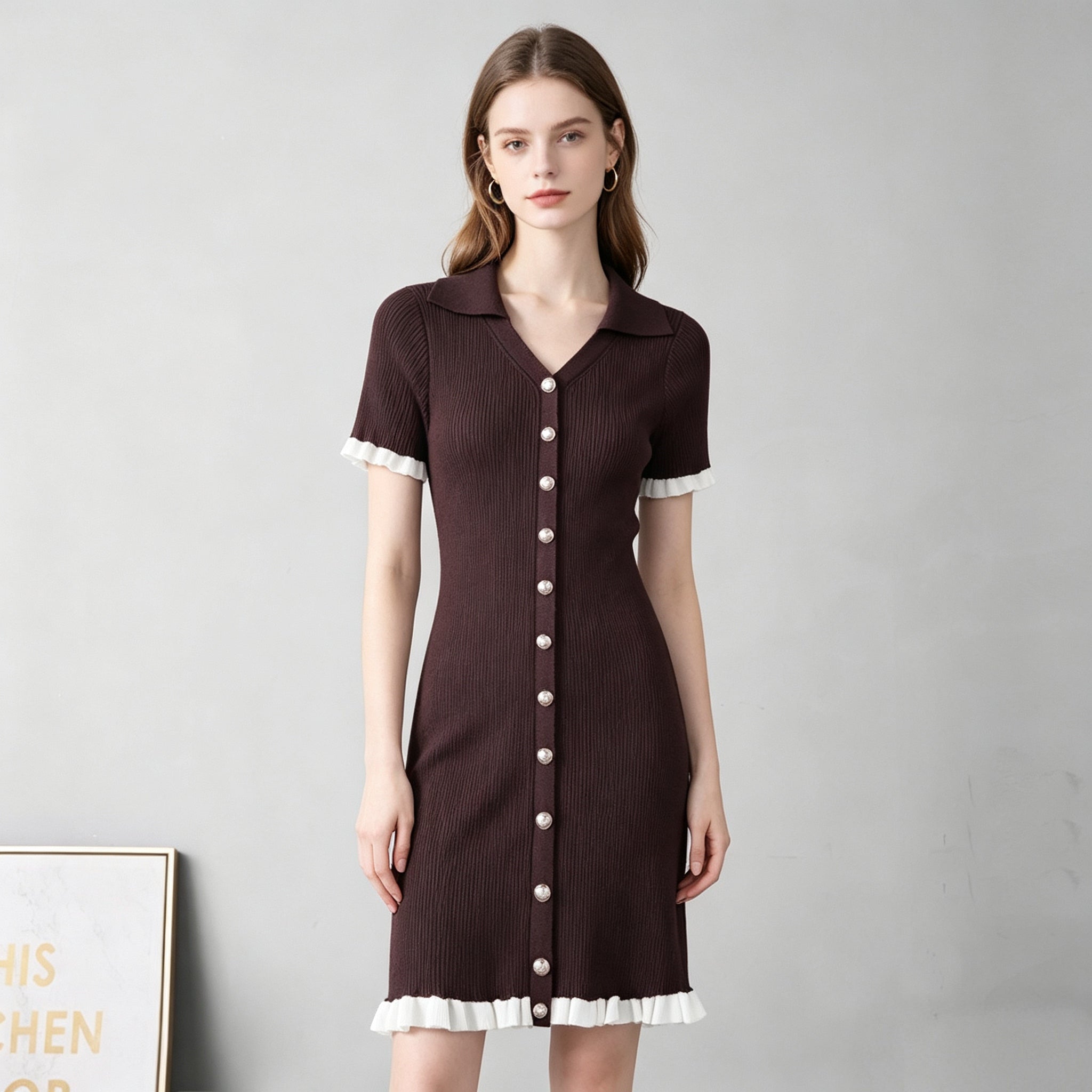 Dark brown ribbed knit button-front dress with pointed collar and short sleeves, white trim