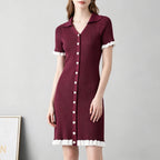 Burgundy ribbed knit button-front dress with pointed collar and ruffle-trim hem, white trim