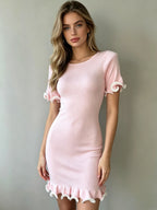 Pink women's knit ruffled dress with short sleeves and scalloped ruffle hem