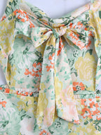 Floral bow-tie detail at the bodice with elastic waist