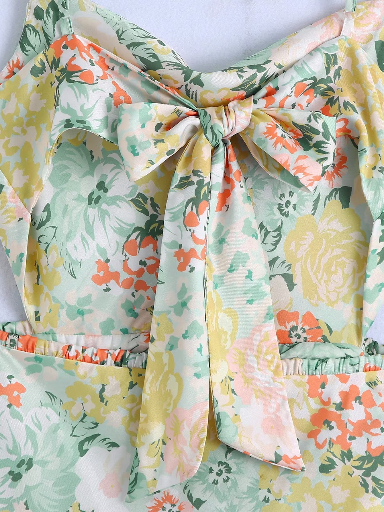 Floral bow-tie detail at the bodice with elastic waist