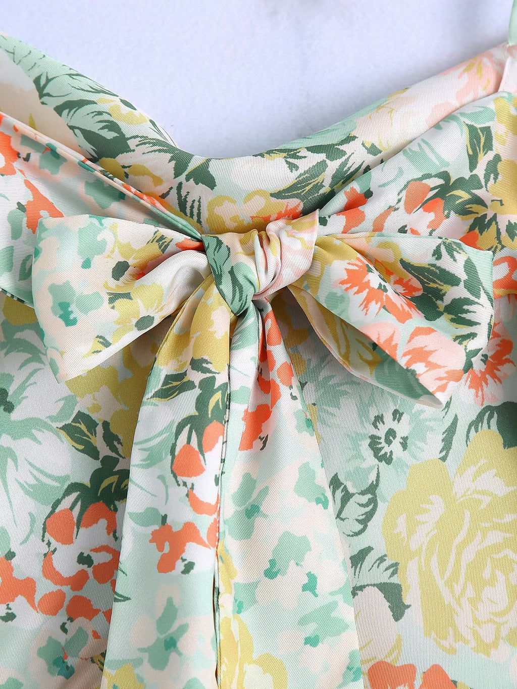 Floral neckline bow knot with spaghetti straps and soft gathered fabric