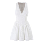White lace sleeveless dress with deep V yoke and button front, pleated skirt