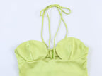 Green satin midi dress with spaghetti straps and ruched sweetheart neckline