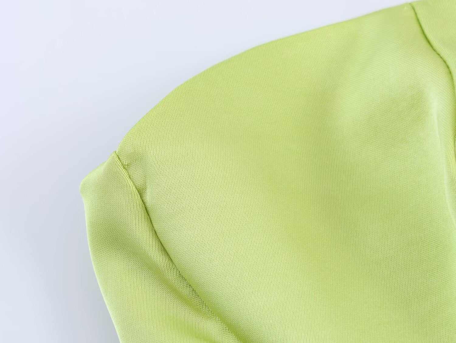 Green satin midi dress back with draped seam and smooth fabric