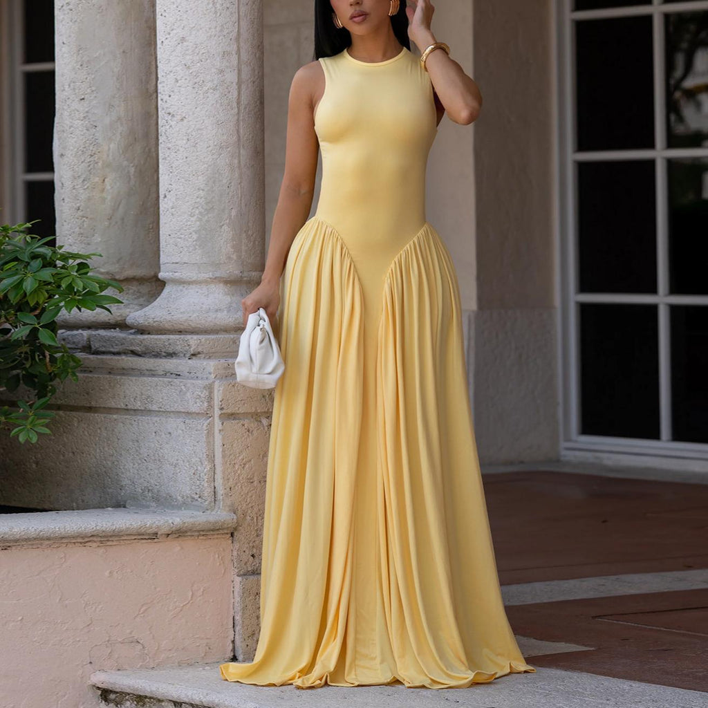 Yellow sleeveless dress with high neck and gathered A-line maxi skirt