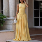 Yellow sleeveless dress with high neck and gathered A-line maxi skirt